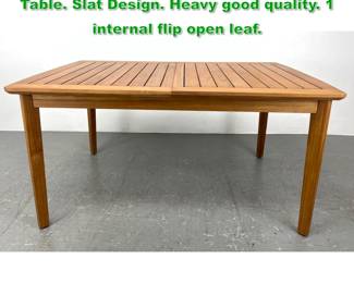 Lot 1215 Modernist Style Solid Teak Dining Table. Slat Design. Heavy good quality. 1 internal flip open leaf.