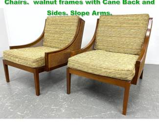 Lot 1181 Pair American Modern Lounge Chairs. walnut frames with Cane Back and Sides. Slope Arms. 