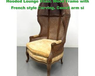 Lot 1107 MARIANE GARCIA Spanish Caned Hooded Lounge Chair. Wood Frame with French style Carving. Caned arm si