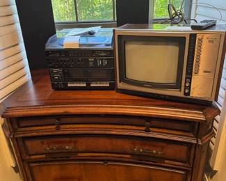 Wooden Filing Cabinet, Stereo and Speaks with turn table,  and Sony Vintage TV with the remote