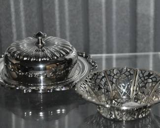 Admire the Intricate Design of this Three-Piece Silver Plate Butter Dish, it is Sure to Add A Touch of Class to Any Tabletop. ($30) And To the Right is a Silver Plate Lace Cut Trinket Dish, ($15).