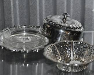 A Full Image of all 3 Pieces of the Silver Plate Butter Dish, Base, Lid & Glass Insert ($30) beside a Woven Silver Plate Bowl. 