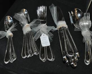 Classic Bead Glossy Stainless Steel Flatware by Lenox, 4 Piece Place Setting for 6 with Serving Pieces, ($95).