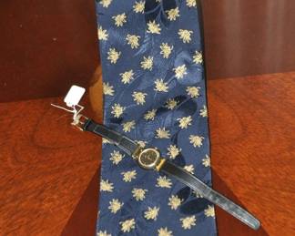 Stunning Brioni Silk Tie ($50) Shown with a Woman’s Movado Museum Watch ($50)