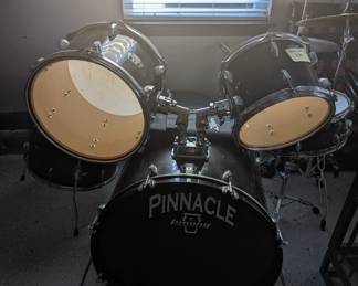 Full Pinnacle drum set with drum sticks and mat