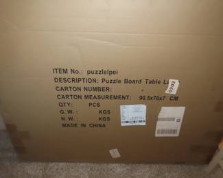 Brand new in box jig saw puzzle table.