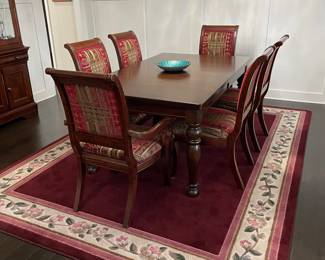 Ashley Furniture expanding dining room table and chairs.