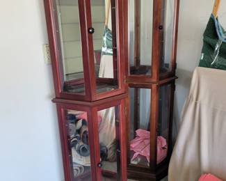 A pair of lighted etageres with mirrored backs