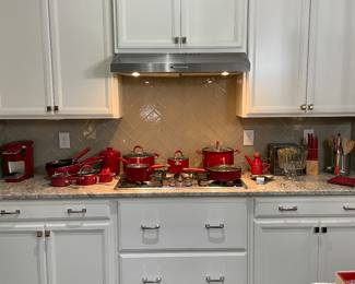 KitchenAid red pots, pans, and lids