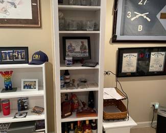 White slim shelf unit - 2 available - , 19"W x 14"D x 80"H,  $75 each. (ITEMS ON SHELVES NOT FOR SALE.)