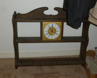 Wall shelf with built-in clock