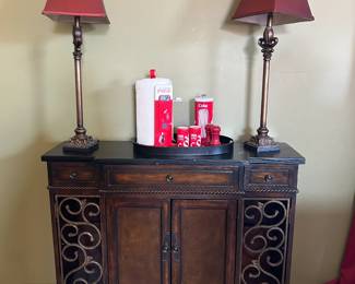 Beautiful Buffet Style Cabinet adorned with 2 tall stem base lamps.
