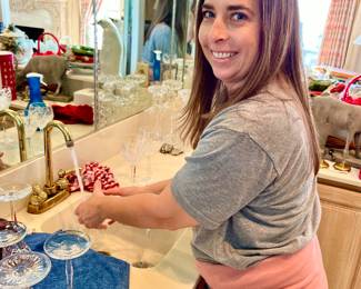 NAOMI WASHING THE CRYSTAL AND GLASSWARE.