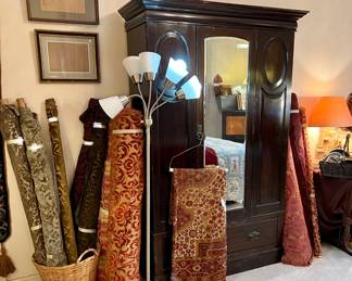 ANTIQUE ARMOIRE WITH MULTIPLE BOLTS OF DAMASK, SILKS, VELVETS, JAQUARD.
