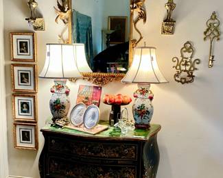 French black commode with beautiful bird paintings.