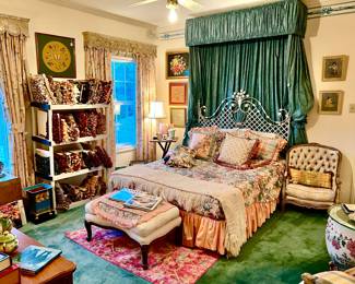 Queen bedroom with more notions, pillows, and art.