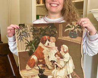 Me showing off just one of the many needlepoints.  Frame for instant art, use to make a pillow, chair seat...so many things you can use these for!