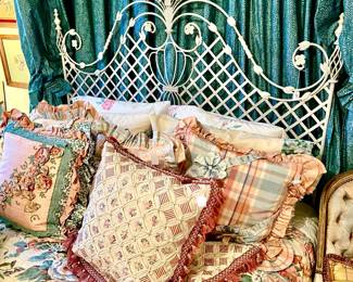 AMAZING METAL QUEEN HEADBOARD WITH BEAUTIFUL PILLOWS.