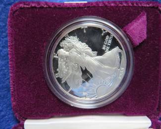 Lot 123. 1988 Silver American Eagle 31.072 gr. oz. of 99.9% silver with COA and an attractive display box