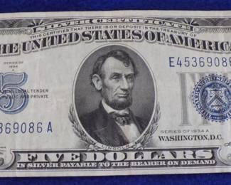 Lot 36. Series 1934A $5 Silver certificate in excellent condition