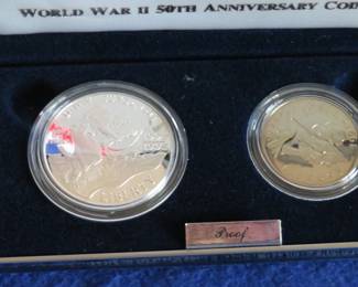 Lot 106. 1991-1995 World War II 50th Anniversary Commemorative Two-Coin Proof Set including a 90% silver dollar, a clad half dollar, COA and an attractive display case