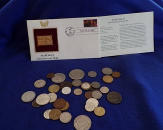 Lot 21. Foreign coins and a June 6, 1994, First Day of Issue Stamp canceled at USS Normandy Sta.