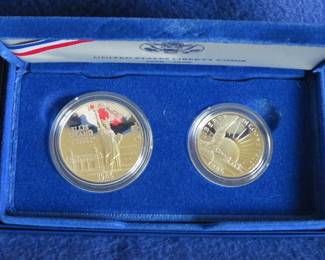 Lot 108. US Mint Liberty Two-Coin Proof Set including a 90% silver dollar, a clad half dollar, COA and an attractive display case