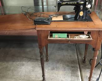 Single sewing machine in cabinet