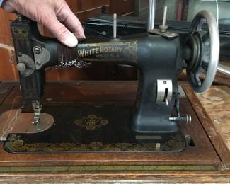 White Rotary sewing machine in cabinet