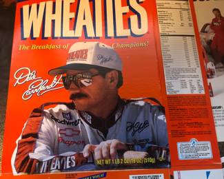 10 different cereal boxes with racing people on them.