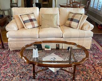 Roll Arm Cream colored 3 seat sofa.  Sofa measures 80"L and is 34h and 34d.  Coffee table measures 44wx36dx19h