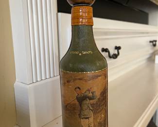 Leather wrapped bottle, golf motif 