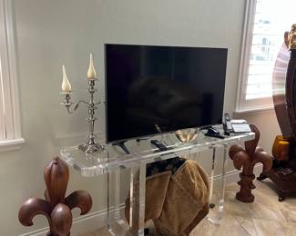 TV - acrylic TV stand - silver like large candlealbras 
