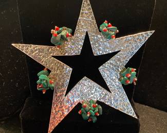 Emilia Castillo sterling star ornament with malachite and coral decor.