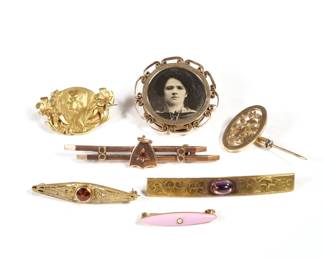 (7pc) ANTIQUE 14K GOLD PINS | a 1908 bar pin with amethyst cabochon, an art nouveau pin with a portrait of a woman (1-1/8 in.), two bar pins with red stones, a small pin with pink enamel and seed pearl, a monogram stick pin, a pin with an old portrait photograph (7.6g); all together 23.1g

