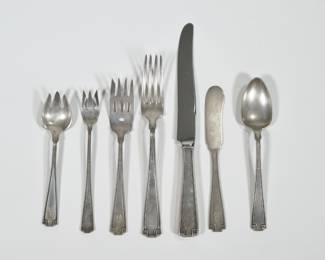 GORHAM ETRUSCAN PATTERN STERLING SILVER FLATWARE | Comprising; 8 dinner forks, 8 dinner knives, 8 dessert forks, 12 ice cream forks, 17 teaspoons, 8 flat handled butter spreaders, 8 cocktail forks, plus serving utensils: a cold meat fork, a serving fork, 3 serving spoons, 2 tablespoons, a ladle, tongs, a master butter, and two pastry spoons; total weighable silver 68.2 ozt

