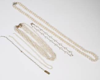 (4pc) PEARL & GOLD JEWELRY | Including a pearl necklace with 7.5mm pearls and a 14k white gold and diamond clasp (30 in.); a five-strand necklace with a 14k yellow gold bow-form clasp (broken, 15 in.); a 14k gold chain bracelet mounting small pearls with a name plate; and a gold-filled chain necklace with pearl stations.