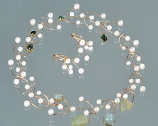 (3pc) BETSY FULLER STUDIO SCULPTURAL GEMSTONE & GOLD WIREWORK JEWELRY | Designed as a necklace with 16 interchangeable 14k gold wirework links mounting round while pearls, moonstones, beach glass, and bluish green cabochons (18 in., 59.1g), plus a pair of matching 14k gold wirework earings mounting pearls (2 in., 8.6g); two gemstone gold backings engraved "(c) 1987 / BESTY FULLER"
62.8g
