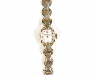 LONGINES 14K GOLD LADY'S WRISTWATCH | on a bracelet of hollow textured links, marked "14k"
l. 6.5 in.
