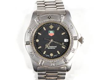 TAG HEUER MEN'S WRISTWATCH | Tag Heuer Professional 200-meter men's watch with black dial in a stainless steel case and band. 
