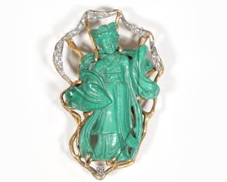 CARVED MALACHITE, DIAMOND & GOLD GUAN YIN BROOCH | Designed as a carved malachite figure of guan yin with flowing robes set within an openwork gold surrounded mounting a ribbon of melee diamonds and one single full-cut diamond below the figure. 2.25 in., 18.8g

