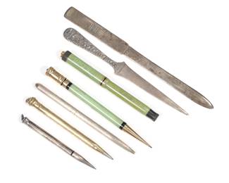 (7pc) DESK ITEMS | Including two Bakelite and gold Parker pens (one Lucky Curve), a Wahl gold-filled pencil, a Tiffany & Co. sterling (Germany) ballpoint pen, a sterling pencil, an S. Kirk & Son repousse sterling letter opener, and a Tiffany & Co. monogram sterling letter opener

