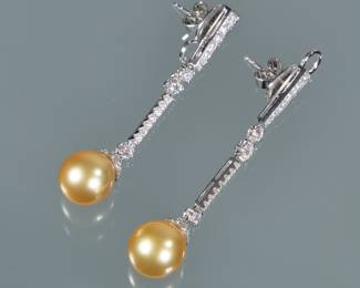 PAIR PEARL AND DIAMOND DROP EARRINGS | Having hard links set with melee diamonds each suspending a round champagne-colored pearl (10.5mm); 2 in., 9.7g
