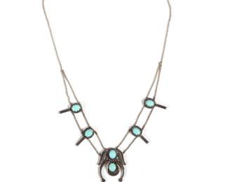 STERLING & SILVER SQUASH BLOSSOM | Native American squash blossom of small size, having six turquoise cabochons set in sterling silver on a sterling ball chain, pendant 1-3/8 x 1-1/8 in. total weight 0.67 ozt, l. 16 in. (chain)
