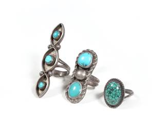 (3pc) NAVAJO TURQUOISE RINGS | Turquoise set in silver, including a spiderweb turquoise ring, a ring signed "DG" with two stones, and a long ring with three turquoise stones (l. 2.25 in.), all settings tested as silver; all together 0.85 ozt

