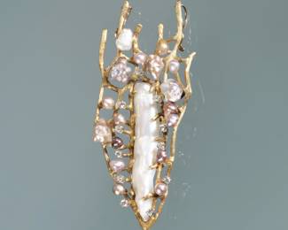 CONTEMPORARY AMORPHOUS PEARL AND DIAMOND PENDANT | Designed as a long amorphous white baroque pearl surrounded by colored pearls and melee diamonds set in textured 18k gold . 3 in., 23.6 g
