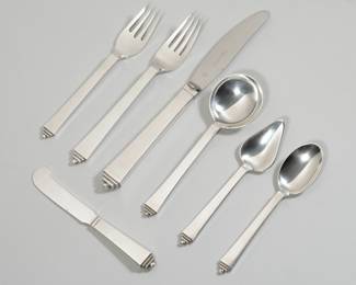 GEORG JENSEN PYRAMID PATTERN STERLING SILVER FLATWARE | Service for twelve (12) comprising; 12 dinner forks (7.25 in.), 12 dinner knives, 12 salad forks, 12 cream soup spoons, 12 teaspoons, 12 grapefruit spoons, and 12 flat handled butter spreaders; No monogram, 103.8 ozt total weighable silver

