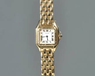 A LADIES PANTHERE DE CARTIER 18K GOLD WRISTWATCH | White dial with Roman numerals, stylized rectangular border, sapphire crown, on a matching 18k gold five-row maillon panthere link bracelet, quartz movement, case s/n 8669117595, case and bracelet signed "Carter" and impressed with swiss hallmarks. 67.8g total weight, l. 7 in. (approx)
