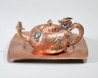 GORHAM DRAGON COPPER & APPLIED METALS CIGAR LIGHTER | Designed as a hammered teapot-form cigar lighter with chased dragon form handle and applied silver crab, leaves, and butterfly on a similar Gorham copper tray.  - l. 5 in. (teapot)
