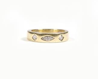 SAM LEHR DIAMOND & 18K GOLD RING | Mounted with a marquise diamond and two 1/4 carat diamonds, sizing buttons. size 7, 7.3g
